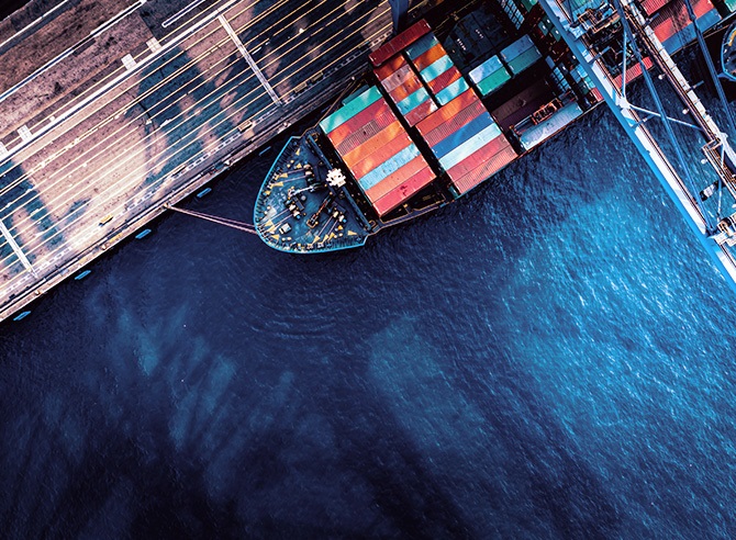 Image of ship docked at container terminal - Links to Geoeconomic threat