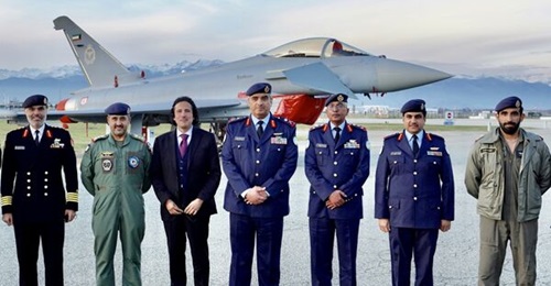 Kuwaiti officers and the emirate's ambassador to Italy stand next in front of one of the first two Typhoons to be handed over at Leonardo's Caselle production facility.