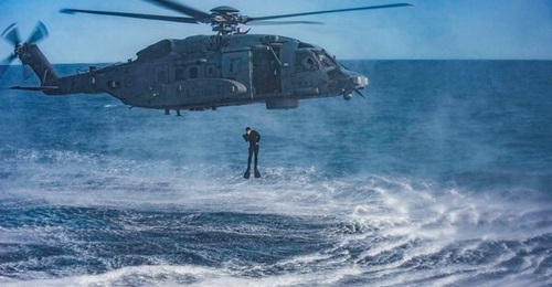 A diver from HMCS 
        
        (FFH 333) dives from a CH-148 helicopter during Exercise 'Cutlass Fury 21' off the east coast of Nova Scotia on 15 September. The RCAF completed a special inspection of its CH-148 fleet and found that 19 of ...