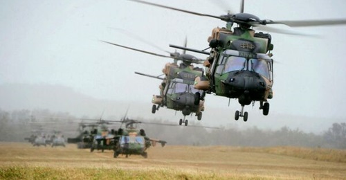 Australia is to replace its MRH-90 Taipan helicopters (foreground) with new UH-60M Black Hawks, the country's defence minister announced on 10 December.