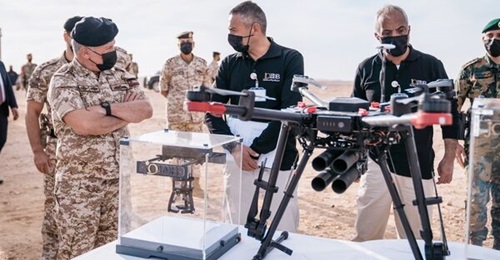 King Abdullah II (left) inspects JODDB's unmanned multicopter.
