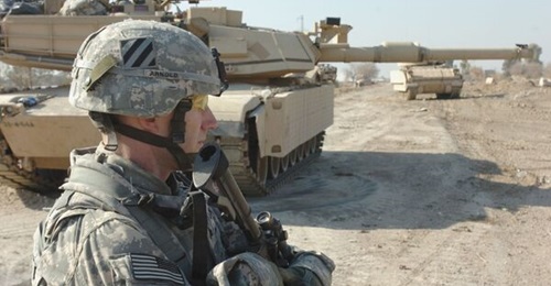 US soldiers from 2nd BCT, 3rd Infantry Division, pull security in front of Combat Outpost Meade in Iraq.