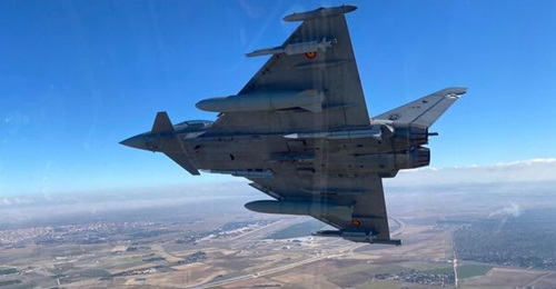 A Spanish Eurofighter combat aircraft carrying a pair of Meteor missiles on its underfuselage weapon stations.