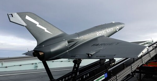 A QinetiQ Banshee Jet 80+ target vehicle pictured on its launcher on HMS 
        
        's flight deck during trials in September 2021.