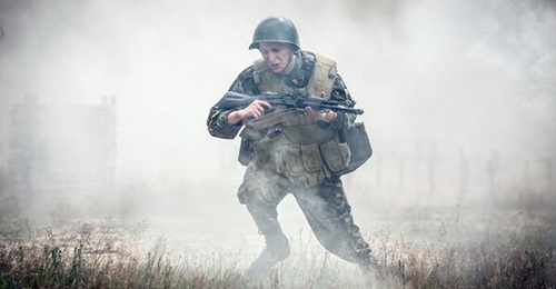 A soldier in action during a military exercise in the Donbass region, Ukraine.