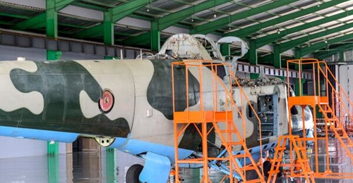 An Mi-24 attack helicopter is worked on at the Pro Heli International Services facility that was opened at Uganda's Nakasongola Air Base on 22 January.
