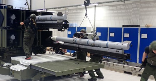 Norwegian Technical Support Staff loading AMRAAM missiles into the Australian Army's NASAMS Mk 2 Canister Launcher as part of Factory Acceptance Testing in Kongsberg, Norway from October to December 2021.