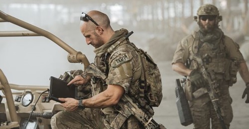 An operator using a DroneSentry-X tablet with TAK enabled. DroneGun MkIII is pictured to the right.