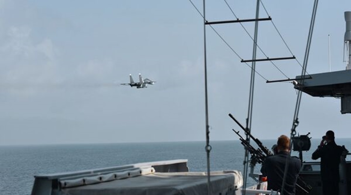Russian Su-30SM multirole fighter carrying what appears to be a Kh-31 anti-ship missile flying by the RNLN LCF frigate 
        
         in the Black Sea on 24 June.