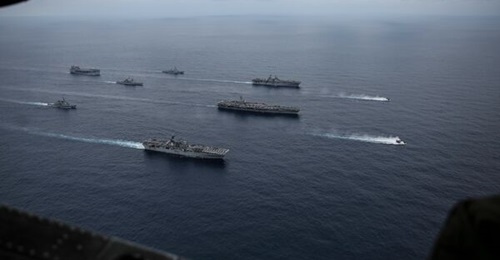 Ships from America and Essex Amphibious Ready Groups, and Abraham Lincoln Carrier Strike Group, sail in formation with the Japan Maritime Self-Defense Force during Exercise 'Noble Fusion'.