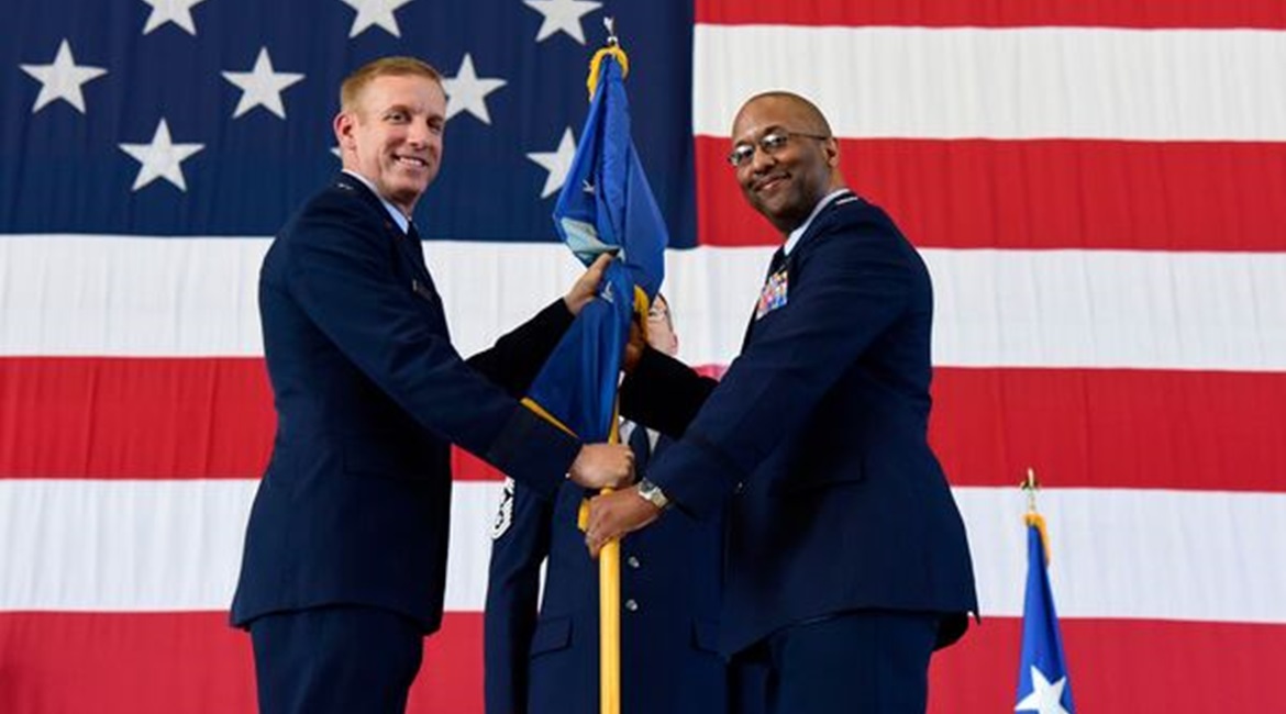 US Air Force Colonel William Young accepts command of the 350th Spectrum Warfare Wing from US Air Force Warfare Center Commander Major General Case Cunningham.
