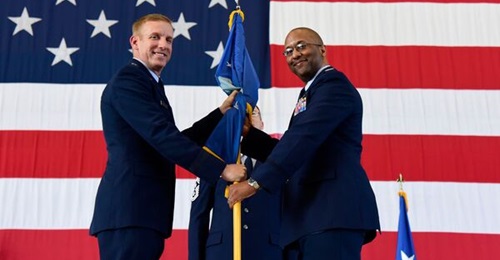 US Air Force Colonel William Young accepts command of the 350th Spectrum Warfare Wing from US Air Force Warfare Center Commander Major General Case Cunningham.