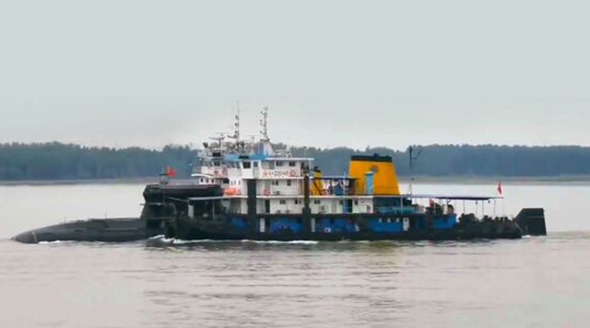 A composite image produced from multiple screengrabs taken from video footage posted on the TikTok social media platform around mid-June showing what appears to be a new conventionally powered submarine for the Chinese navy. The boat is fitted with a r...