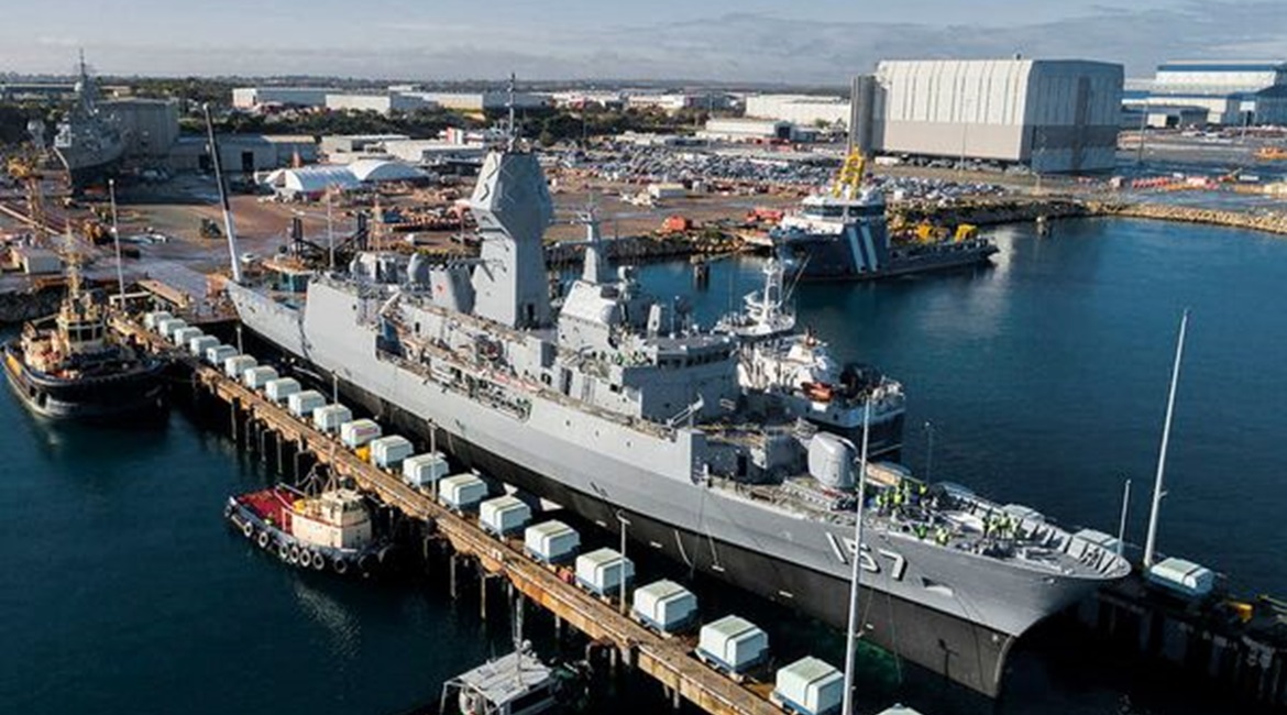 HMAS 
        
         being lowered out of the dry dock at the Australian Marine Complex at Henderson in Western Australia following completion of a major part of the AMCAP upgrades.