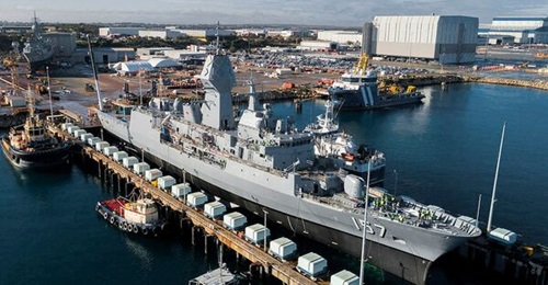 HMAS 
        
         being lowered out of the dry dock at the Australian Marine Complex at Henderson in Western Australia following completion of a major part of the AMCAP upgrades.