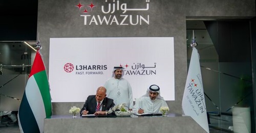 Gary Rosholt, vice-president UAE, L3Harris, and Abdullah Al Awani, executive director, Economic Program Tawazun sign the term sheets in the presence of Matar Ali Al Romaithi, chief economic development officer at Tawazun.