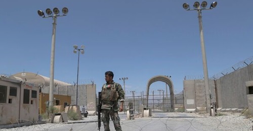 An Afghan National Army soldier stands guard at Bagram Airbase on 2 July after all US and NATO troops left and handed over the base to the ANDSF.