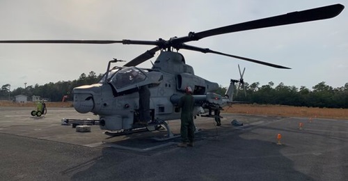 US Marine Corps personnel assigned to Marine Operational Test & Evaluation Squadron 1 (VMX-1) conduct operational checks on AH-1Z Viper to ensure the aircraft readiness during the Operational Test and Evaluation of the AGM-179A JAGM from the platform a...
