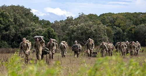 Australian Army soldiers of 7th Brigade arrive in Broadwater, New South Wales, on 7 March, to assist with flood relief efforts. Canberra is looking to expand the strength of the country's uniformed military personnel to respond to future threats.