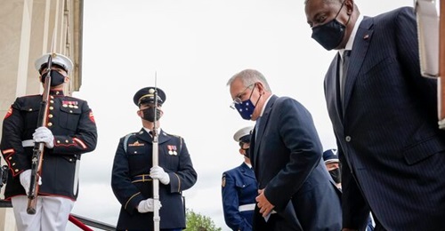 Australian Prime Minister Scott Morrison and US Secretary of Defense Lloyd Austin pass a military honour guard as they walk inside for a meeting at the Pentagon on 22 September 2021. A week earlier, Australia, the US, and the United Kingdom announced t...