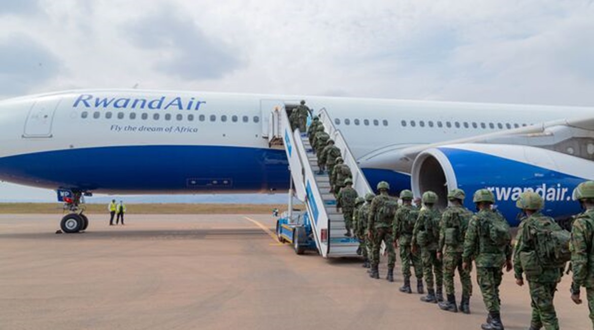 Rwandan troops embark on an airliner destined for Mozambique at Kigali International Airport on 10 July.