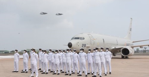 Personnel of the Indian Navy's newly commissioned 316 Squadron stand in front of a Boeing P-8I at INS Hansa in Goa on 29 March 2022.