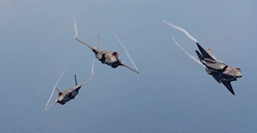 Three Royal Australian Air Force F-35As fly off the country's east coast. RUAG Australia and its future owner, Asdam Group, both support the F-35 programme.