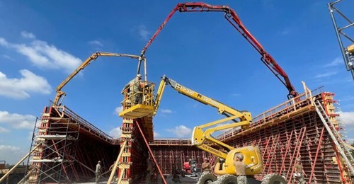 A detachment from US Naval Mobile Construction Battalion 11 pours concrete for the walls of a new building at Hatzor Air Base.