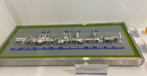 A model of Poly Defence's automated production facility for handheld grenades was displayed at DSA 2022.