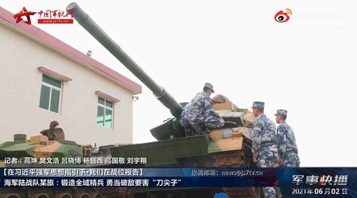 A screengrab from footage released by CCTV on 2 June showing PLANMC personnel inspecting ZTQ-15 light tanks.