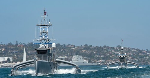 The US Navy plans to build a hybrid fleet with additional unmanned platforms like Sea Hawk (foreground) and Sea Hunter.