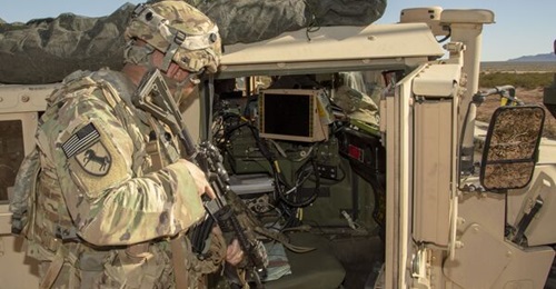 US Army Major Shawn McNicol monitors one of the Mounted Computing Environment systems deployed during technology experiments at Fort Bliss, Texas.