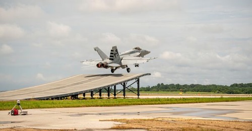 A US Navy F/A-18E takes off from a mock-up of a UK aircraft carrier ramp at Naval Air Station Patuxent River in Maryland in August 2020. Two F/A-18Es are set to conduct ski jumps from India's Shore Based Test Facility (SBTF), which has a slightly steep...