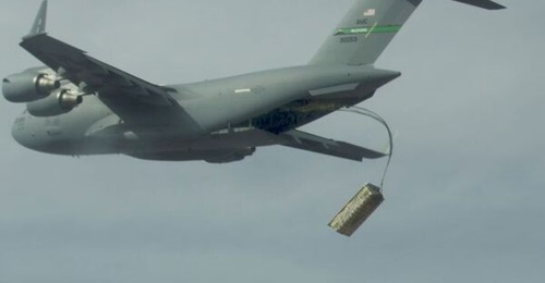 A high altitude airdrop of palletised munitions (JASSM simulants) from a C-17 using standard operational airdrop procedures is conducted during the USAF's Advanced Battle Management Family of Systems (ABMS) Onramp #2 exercise in September 2020