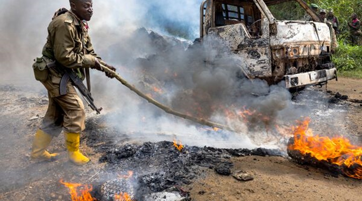 DRC soldiers inspect an ambush site where an hour previously ADF/Wilayat Wasat Afriqiyya insurgents had attacked two vehicles on the road between Beni and the Ugandan border town of Kasindi, on 9 April 2021 in Kilya, Rwenzori Sector, DRC. There have be...