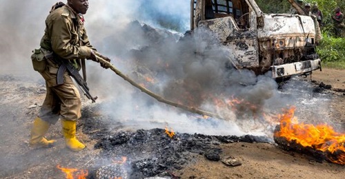 DRC soldiers inspect an ambush site where an hour previously ADF/Wilayat Wasat Afriqiyya insurgents had attacked two vehicles on the road between Beni and the Ugandan border town of Kasindi, on 9 April 2021 in Kilya, Rwenzori Sector, DRC. There have be...