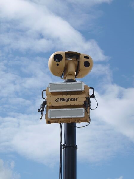 The Blighter Surveillance Systems B402 ground-based target acquisition radar as part of a mast-mounted system with an electro-optical suite above it.