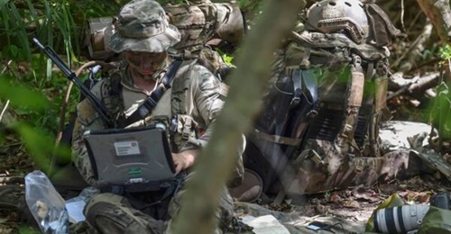 A US Air Force Special Operations Weather Technician sends intelligence to the Reconnaissance Operations Center during the Marine's Reconnaissance Team Leader Course's final exercise on 31 October 2017. SOCOM is soliciting industry proposals to improve...