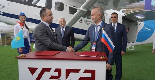 Kazakhstan Aerospace Industries' Daniyar Amangildin (l) and Ural Civil Aviation Works' Vadim Badekha (r) at the signing of KAI's acquisition of a 20% stake in Baikal-Engineering by KAI at the MAKS 2021 Air Show in Moscow, Russia.