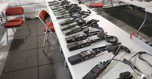 Handheld radios prior to a TSM waveform exercise in February 2020.