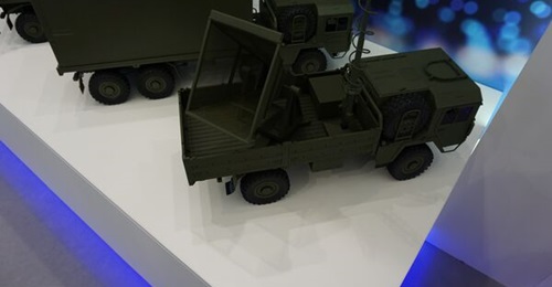 A scale model of the HPEM SkyWolf effector, shown in its truck-mounted configuration.