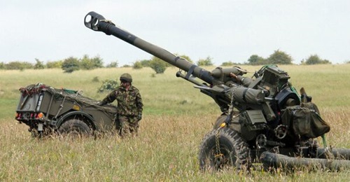 An L118 Light Gun waiting to be airlifted by an RAF Chinook.