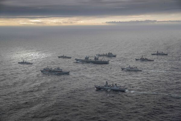 In his 27 July speech about ‘integrated deterrence' Austin pointed to the deployment of Royal Navy aircraft carrier HMS
Queen Elizabeth
to the Asia-Pacific region as the flagship of a multi-nation carrier strike group (seen here) that includes a US destroyer and a US Marine Corps F-35 squadron.
(Crown Copyright)
