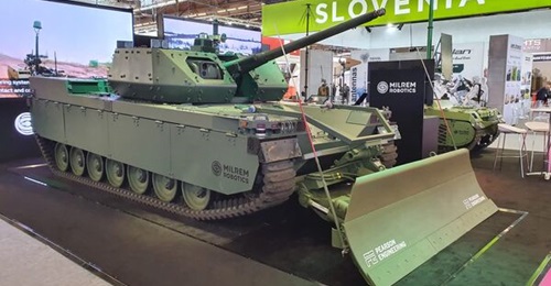 Milrem's Type-X UGV exhibited at Eurosatory 2022 with a Pearson Engineering General Purpose Blade, a Metravib Pilar V gunshot detection system, and a Thales Antares laser warning system.