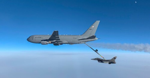 A US Air Force KC-46A Pegasus tanker conducts air-to-air refuelling with a US Air Force F-16 over the Canadian Arctic in March 2021. Service leaders migrated the MAFPS system for air mobility operations into the cloud.