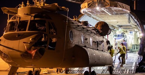 A CH-47F Chinook destined for the Australian Army is unloaded from a USAF C-5M Super Galaxy aircraft at RAAF Base Townsville on 23 June 2022.