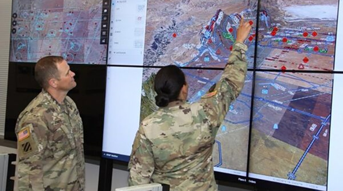 US soldiers observe a demonstration of the Command Post Computing Environment Tactical Service Infrastructure at Aberdeen Proving Ground in Maryland.