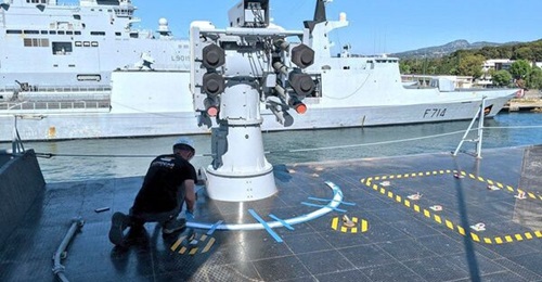 The newly installed Sadral launcher on the starboard side of FS Courbet's hangar roof. Sister ship FS Guépratte, visible behind, is still fitted with the Crotale system.