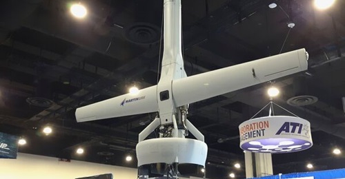The Martin UAV V-Bat 128 vertical take-off and landing (VTOL) tail-sitting fixed-wing unmanned aerial vehicle (UAV) on display at Navy League's 2021 Sea-Air-Space exposition on 3 August 2021. The USMC awarded Martin UAV a contract to develop a...