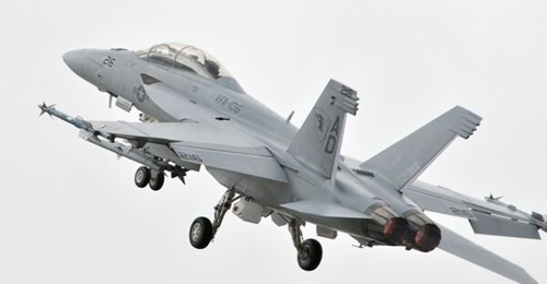 A US Navy F/A-18F Super Hornet seen here during a demonstration flight at the Farnborough International Air Show. Boeing recently concluded a trial of the aircraft type at the Indian Navy's Shore Based Test Facility.